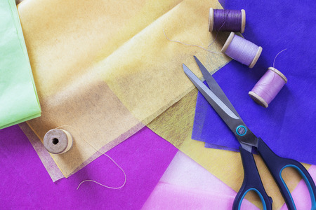 Sewing concept photo with scissors and thread