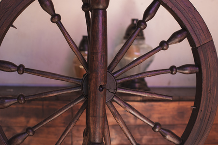 Close up of an old brown spinning wheelの写真素材