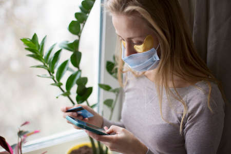 A quarantined European girl is shopping online. Forced measure