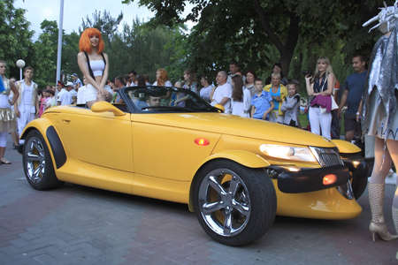 Gelendzhik, Russia, 4 june 2011. Carnival in town of resort Gelendzhik. Woman as lilu on the yellow car.のeditorial素材