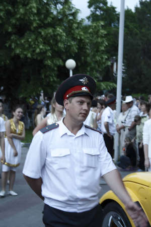 Gelendzhik, Russia, 4 june 2011.  Policeman near car and people around.のeditorial素材