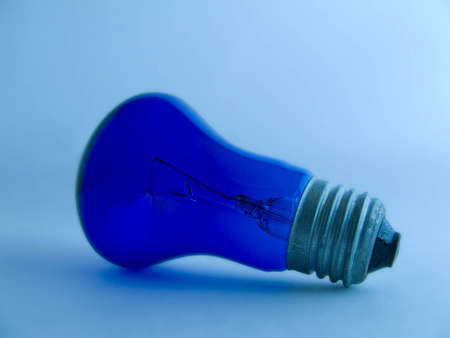 the electrical lamp on the blue background の写真素材