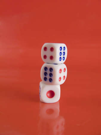 Dice from casino with red backgroundの写真素材