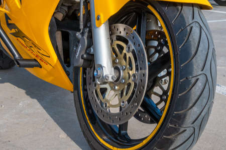 Kazan, Russia-September 26, 2020: Close-up of the front wheel and brake system of a motorcycle standing on the asphaltのeditorial素材