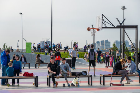 Kazan, Russia-September 26, 2020: In the city park on the embankment, young people play basketball,...
