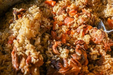 Traditional oriental pilaf on a sunny day, close-up. Step-by-step recipe for real pilaf.の写真素材