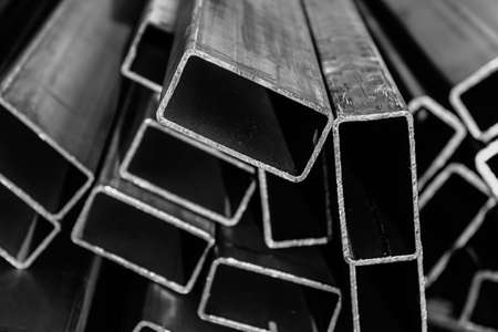 Metal pipes made of rectangular profile in a commercial warehouseの写真素材
