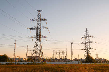 Electricity distribution station. High voltage electric transmission tower. Distribution electric substation with power lines and transformers.の写真素材