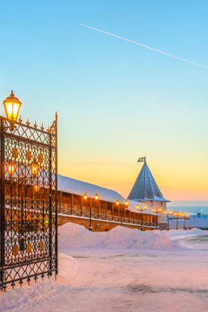 View through the open wrought-iron gates to the courtyard, the fortress wall and the watchtower of the Kazan Kremlinのeditorial素材
