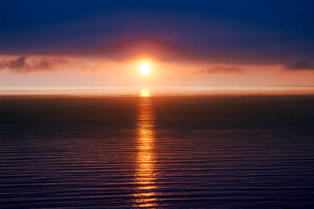 sunset in the sea on a summer evening.の写真素材