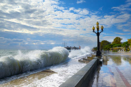 09/30/2021 Crimea. Yalta. Strong waves and wind hitting the embankment