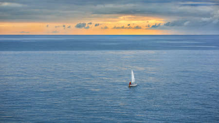 sailing ship in the sea against the blue sky.