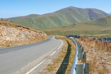 A beautiful winding road to the Djily Su tract with a view of the mountains. caucasus