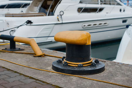 Bollard on the pier with mooring lines.の写真素材