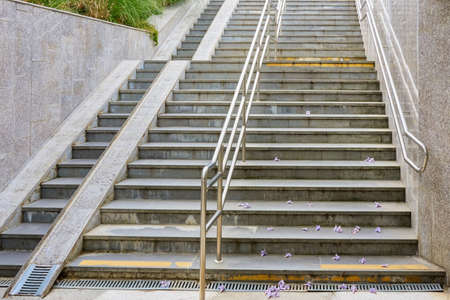 Descent to the underground passage. View of the stairs, nickel-plated handrails and wheelchair...