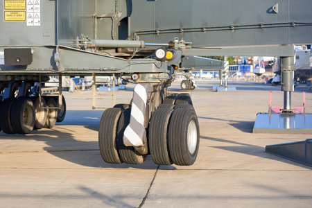 City of Adler, Russia - October 07, 2022. View of the chassis and supports of the port crane. rubber...