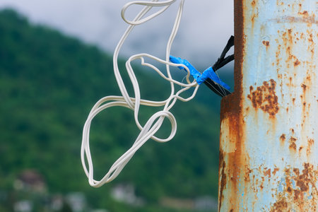Twisted connection of electrical wires. Insulation of the wire connection on the pole, using...