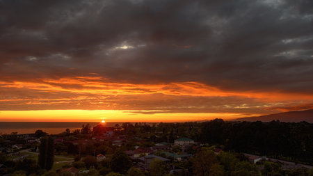Beautiful sunset in Pitsunda. The seashore in the colors of the setting sun. Textured sunset sky.の写真素材