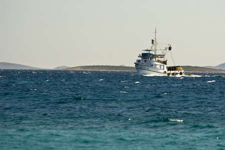 Fishing boat on the open sea coming to Pakostaneのeditorial素材
