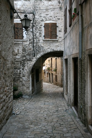 Stony street with the archway in old town Rovinjのeditorial素材