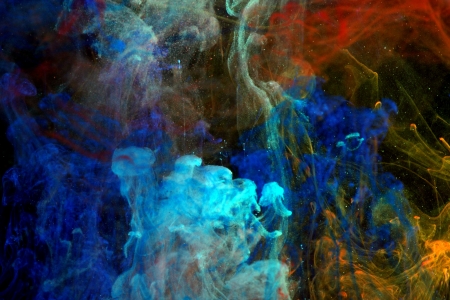 Blue, red and orange ink in the waterの写真素材