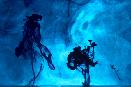 Black ink in the blue waterの写真素材