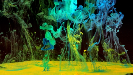 Green, yellow and blue ink in the waterの写真素材