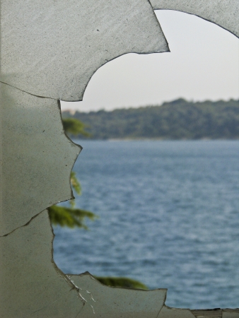 Broken glass on the old windowの写真素材