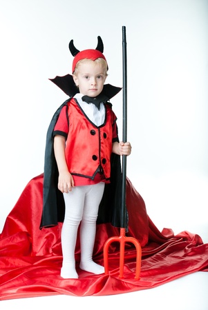 imp is a boy and looks forward to the hand he holds a tridentの写真素材