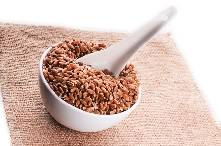 grains are scattered in a bowl on sackingの写真素材