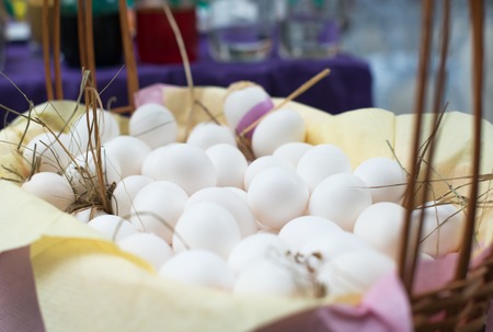 White eggs in basket, shopping for coloring eggs for Easterの写真素材