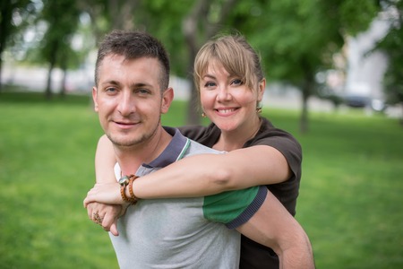 Cheerful couple being happy to spend summer vacation togetherの写真素材