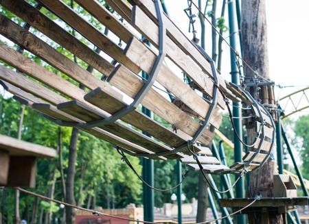 The bridge of logs tied to the ropes, part of a ropes course