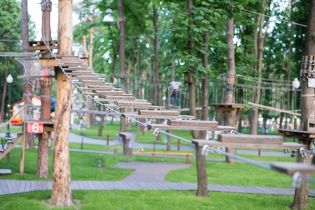 The bridge of logs tied to the ropes, part of a ropes courseの写真素材