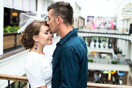the bride and groom in a shopping centerの写真素材