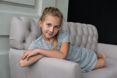 Young girl by the window, adultの写真素材