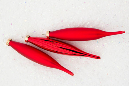 New Year's dressings red icicles on the white glossy isolated backgroundの写真素材