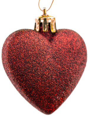 New Year's ornament darkly red matte heart on the white isolated backgroundの写真素材
