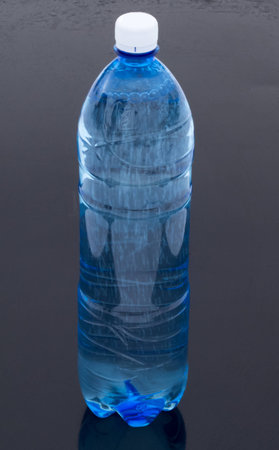 Plastic bottle of sparkling water on a black backgroundの写真素材