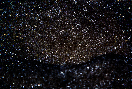 Abstract black background with silvery celebratory spanglesの写真素材