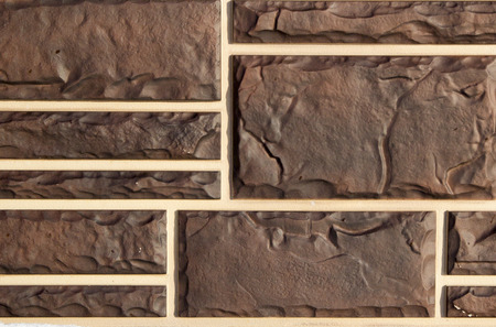 Darkly brown brick abstract backgroundの写真素材