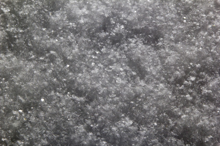 White fluffy snowflakes close up, an abstract backgroundの写真素材
