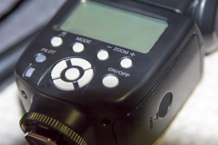 Modern black external flashlight by close upの写真素材
