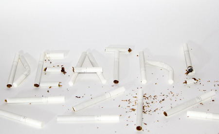 Inscription death from cigarettes on a white backgroundの写真素材