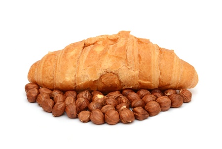 Croissants with chocolate and nuts on the white backgroundの写真素材