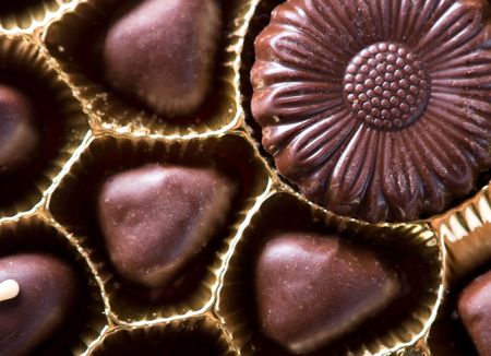 Chocolate sweets in box close up