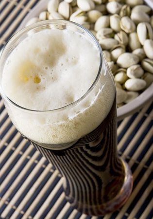 Beer with salty pistachio  close upの写真素材