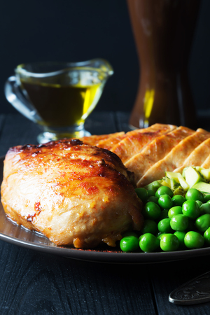 Vertical photo of spicy chicken fillet with peasの写真素材