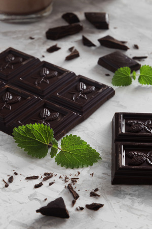 Vertical photo of pieces of mint dark chocolateの写真素材