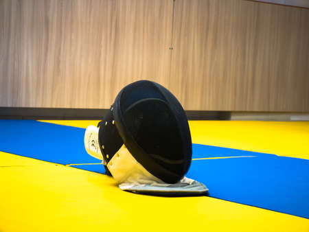 Fencing mask on sport track helmet